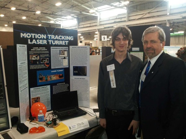 Tom Rachfalski (r), chapter president, congratulates Jacob Heffernan, a junior from Concord High School in Wilmington, Delaware, for winning the chapter's first place prize at the Delaware Valley Science Fair in April.